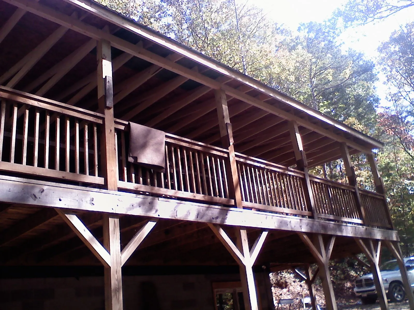 Timber framing under a new elevated porch and deck — Roof Leak Repair in Ostrander by Roofing Brothers